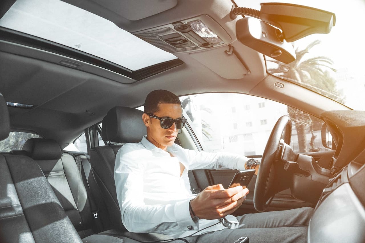 man driving a car